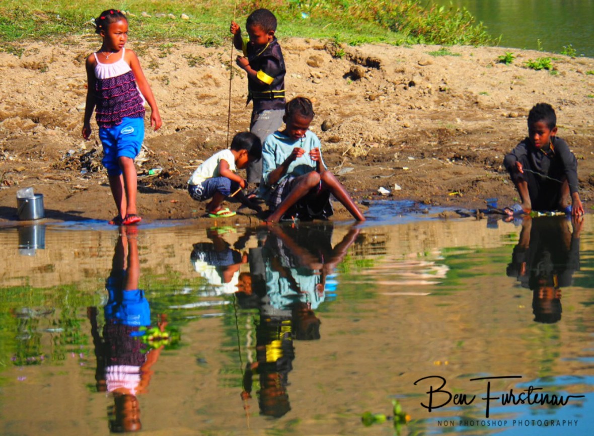 Reflections of children fishing
