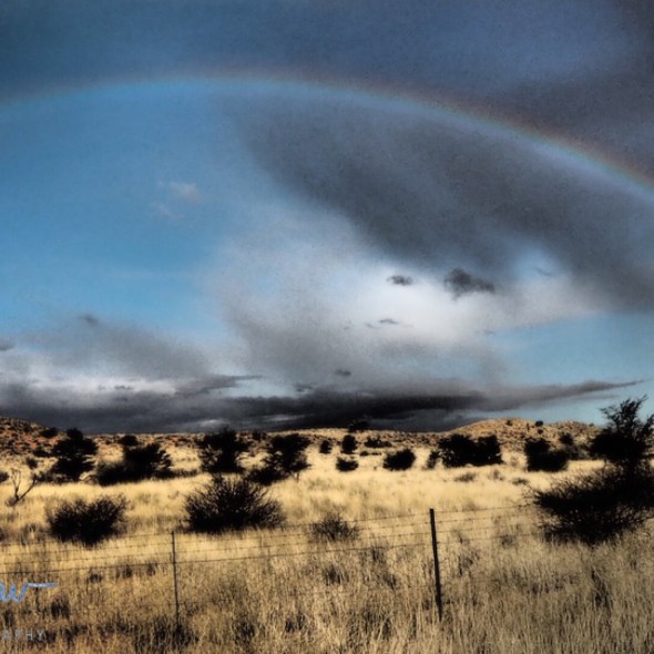 Spectacular rainbow over the arid Kalahari desert, Kgalagadi Transfrontier Park