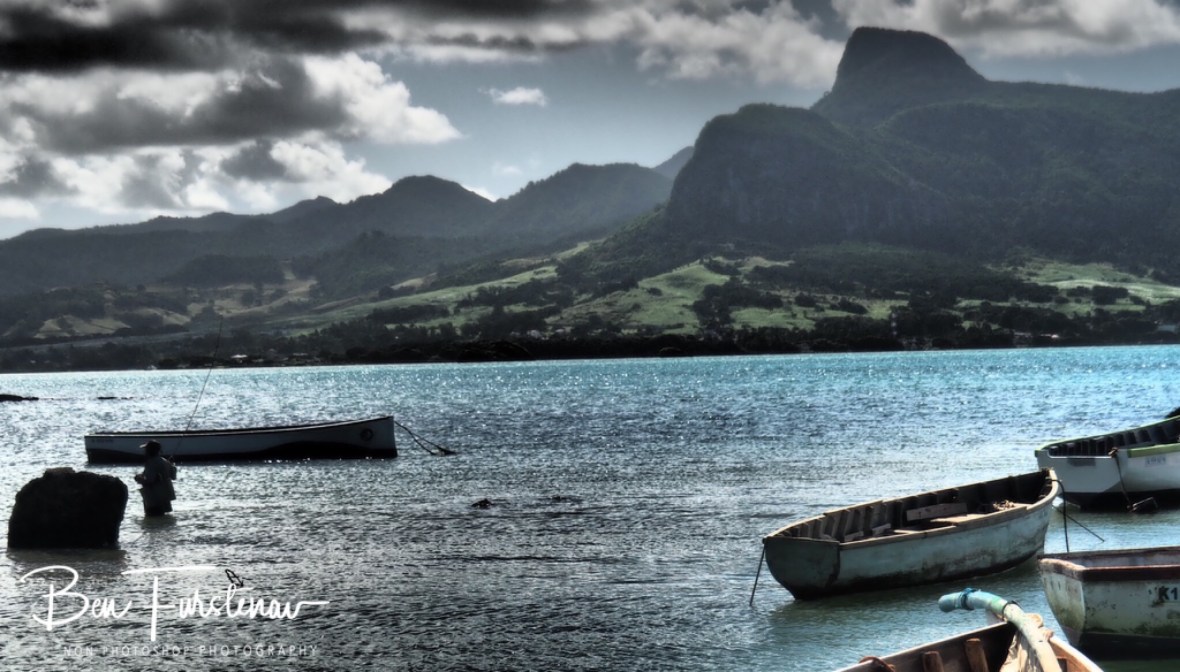 ‘Lion Mountain’ overlooking Mahebourg Bay, a fisherman is trying his luck.