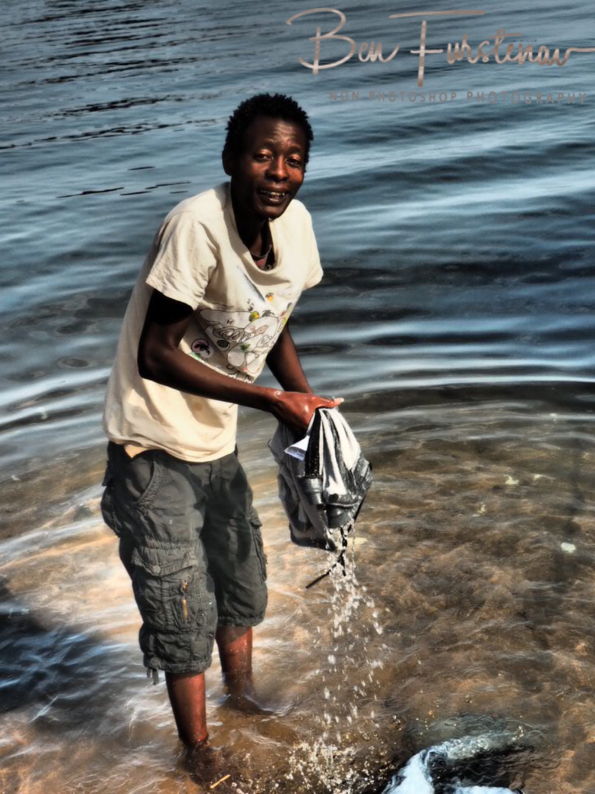 Peter Pumkin doing his laundry, Chembe, Cape Maclear, Lake Malawi, Malawi