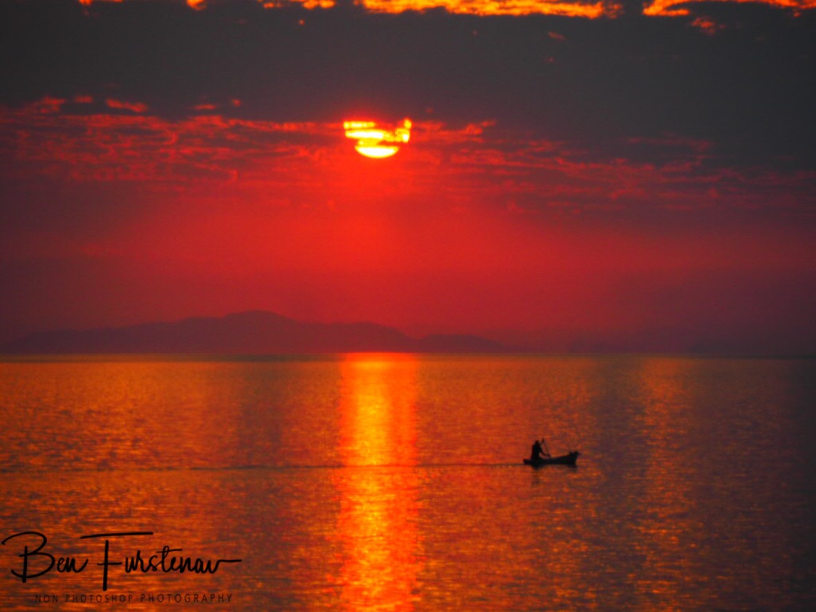 Banana boat fisherman over endless seas at Otter Point, Cape MaClear, Lake Malawi, Malawi 