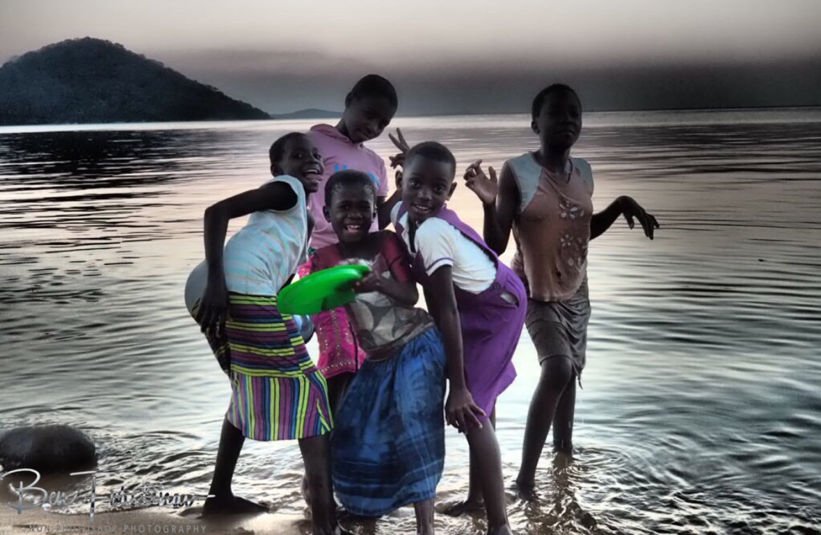Cheeky girl posing in Chembe, Cape Maclear, Lake Malawi, Malawi