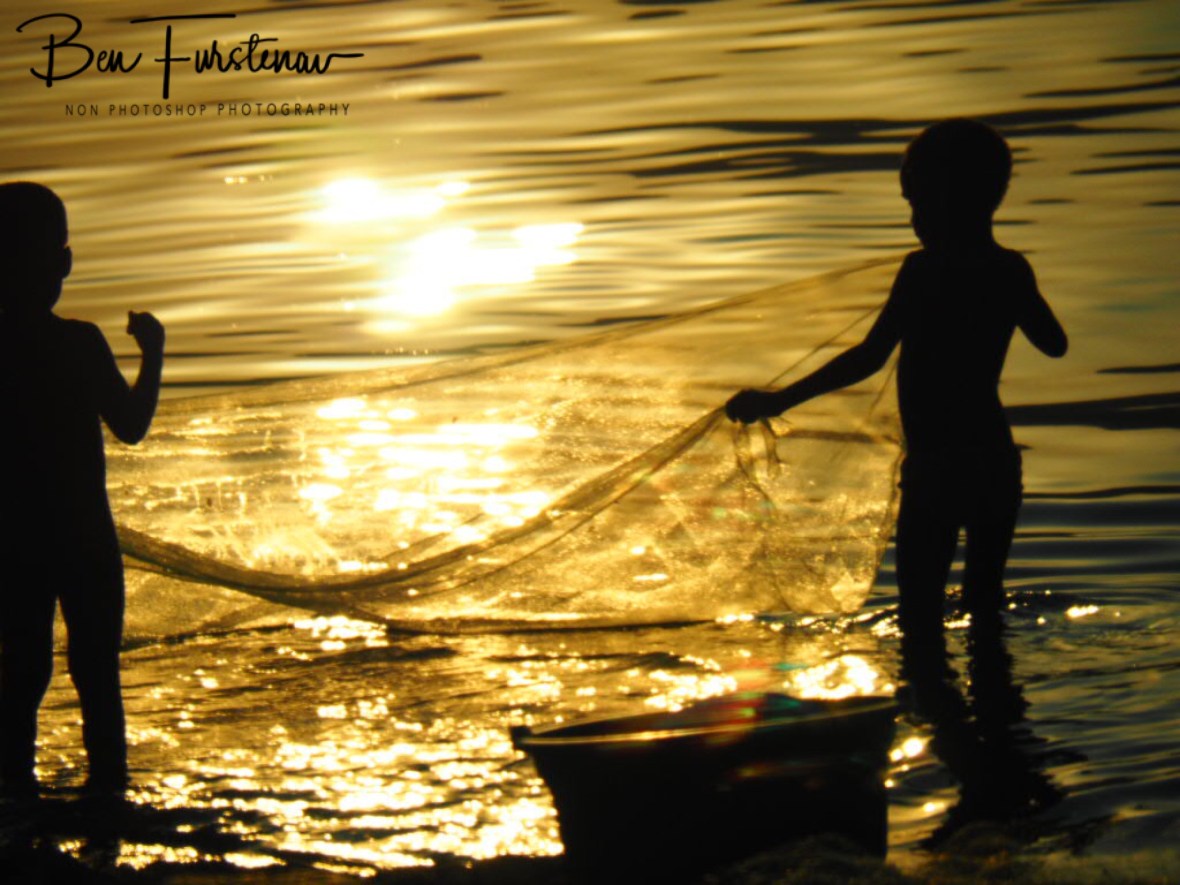 Kids net fishing in Chembe, Cape Maclear, Lake Malawi, Malawi