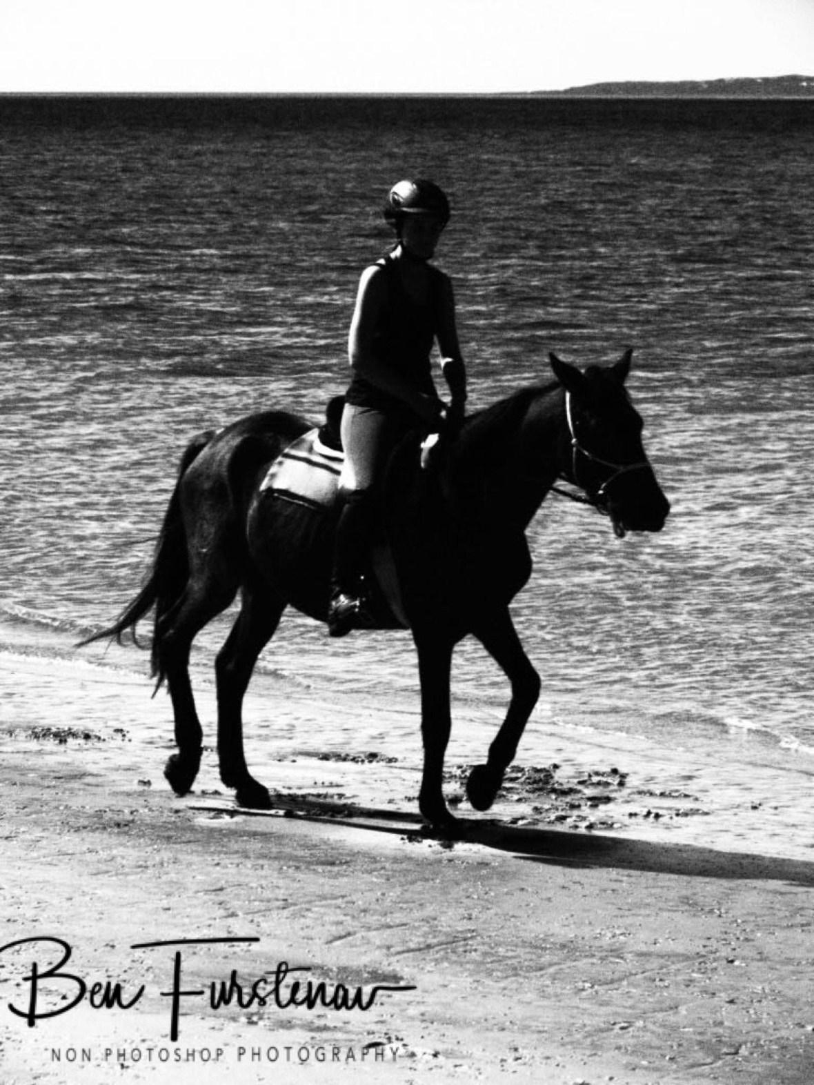 Black and white riding on the beach, Vilankulo, Mozambique 