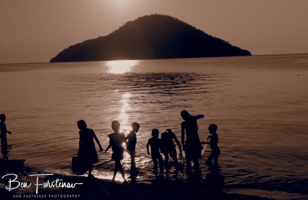 Typical sunset spectacle on Lake Malawi’s shores, Chembe, Cape MaClear, Malawi
