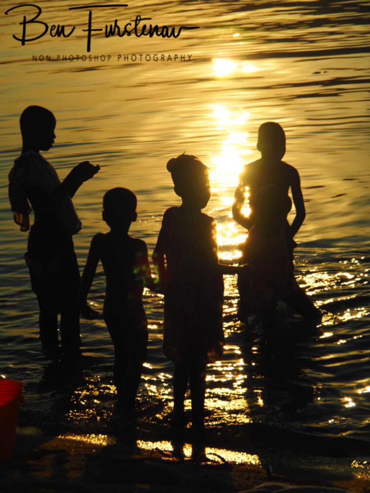 Kids gathering at sunset in Chembe, Cape Maclear, Lake Malawi, Malawi