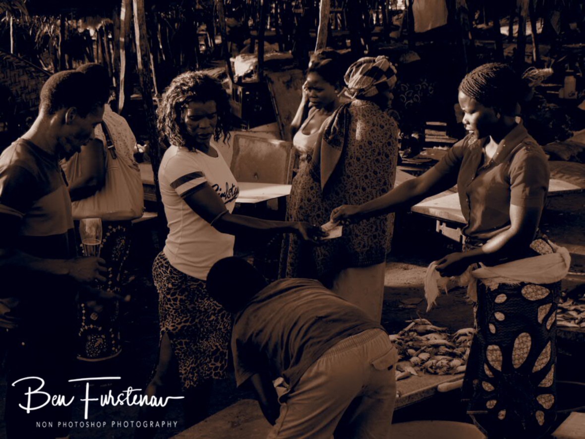 Anna checking produce, Fermento checking beer, Inhambane, Mozambique 