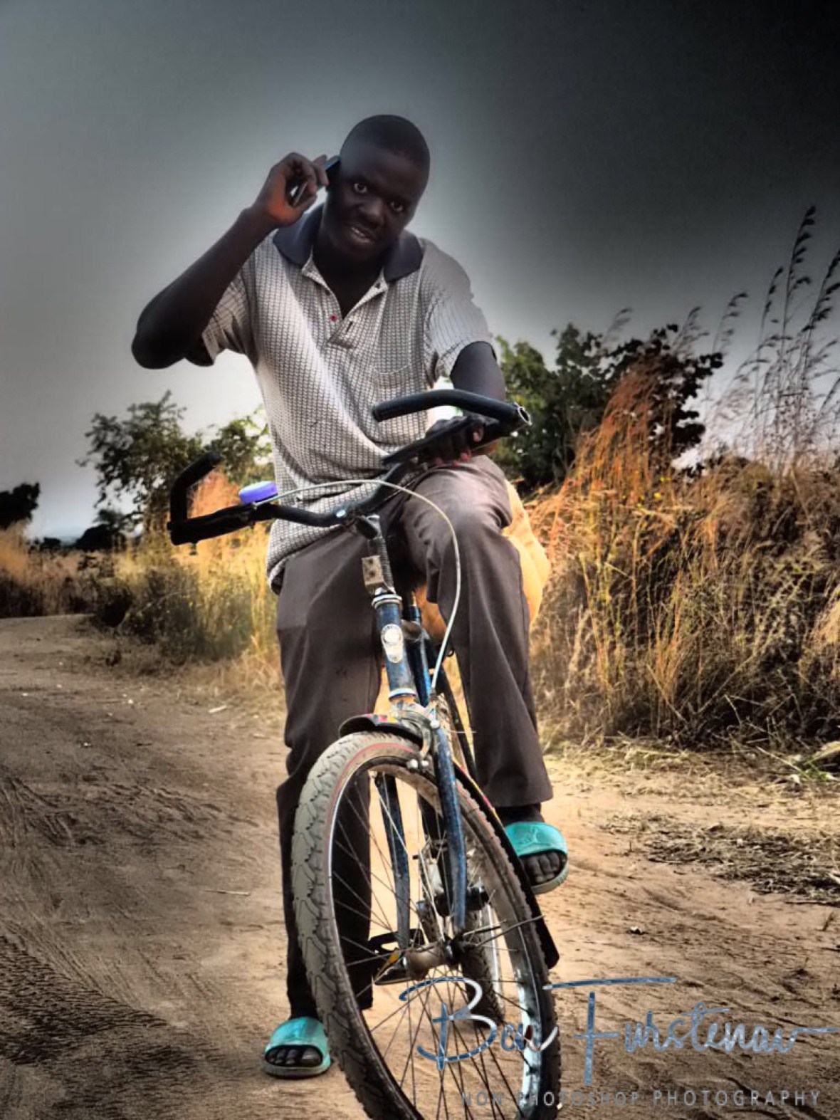 Looking cool on the bike, Northern Region, Malawi 
