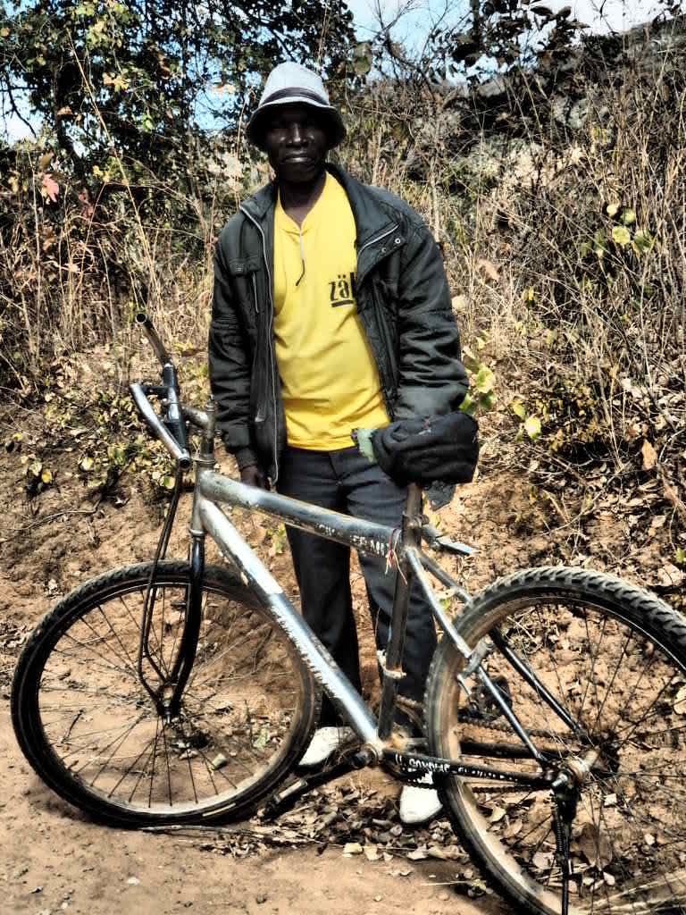 Showing off his modern mountain bike in Northern Region, Malawi 