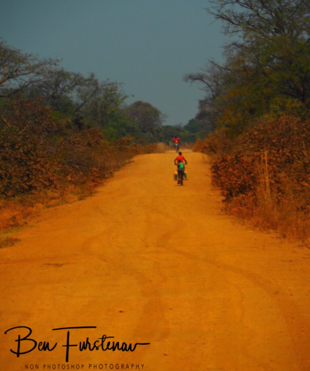 No matter where you are in Africa, always expect a bike to pass you, Blue Lagoon National Park, Zambia 
