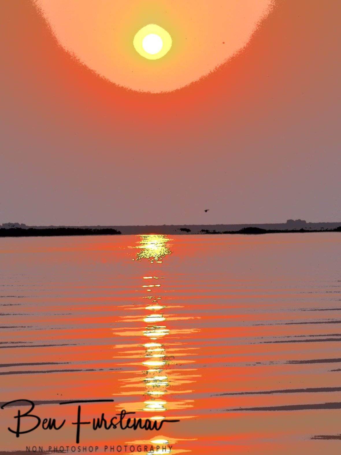 Sun setting over Namibia’s elephants on the Chobe River, Kasane, Botswana 