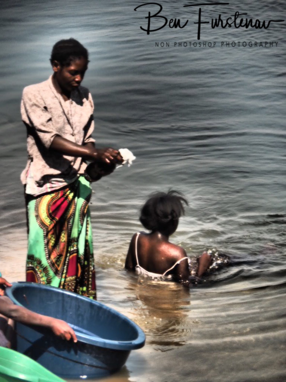 Washing while the ferry is gone in Lukulu, Zambia 