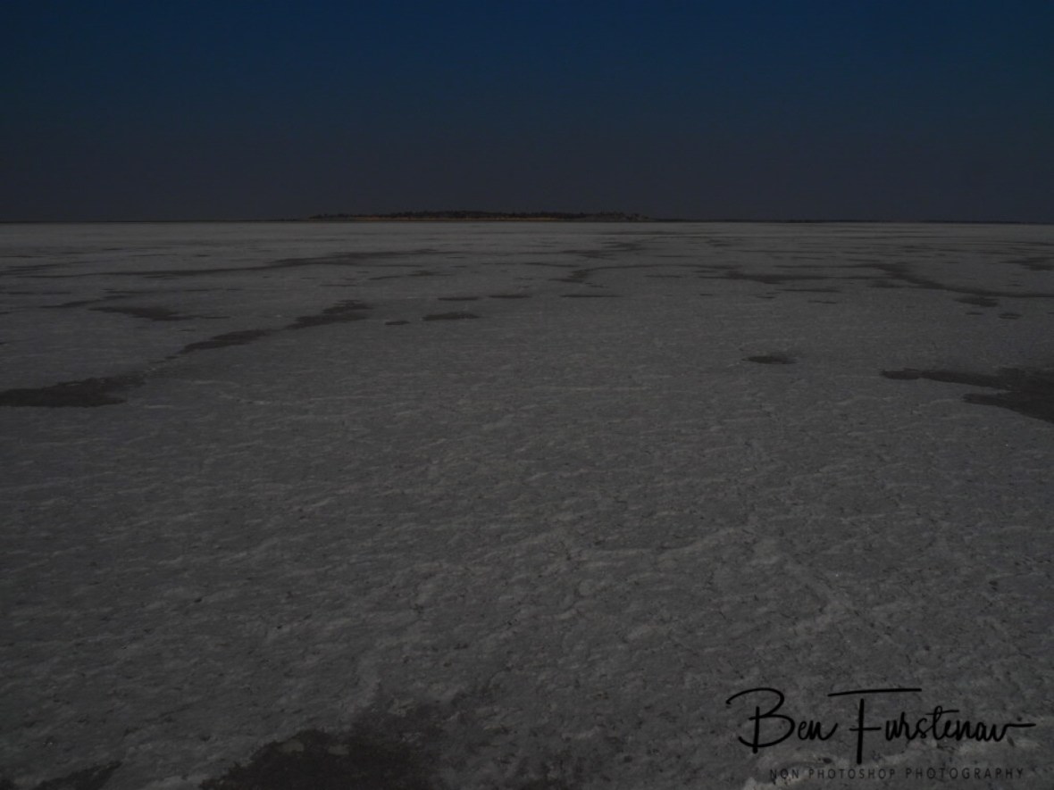 One last glimpse on Kubu Island over the horizon, Makgadikgadi Salt Pans, Botswana 