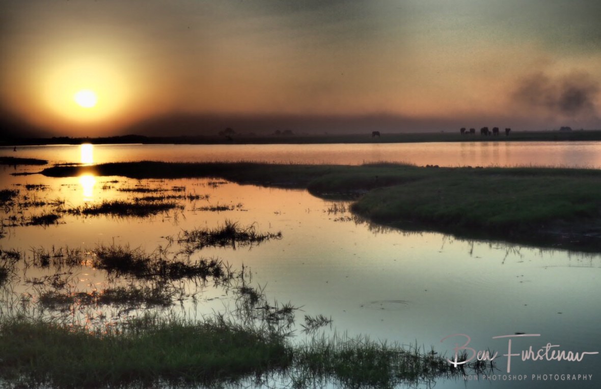 Sunset over calm waters off the Chobe River, Chobe National Park, Botswana