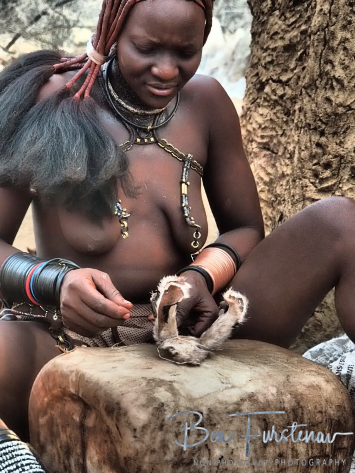 Hat manufacturers, Omusaona Himba Village, Kamanjab, Namibia