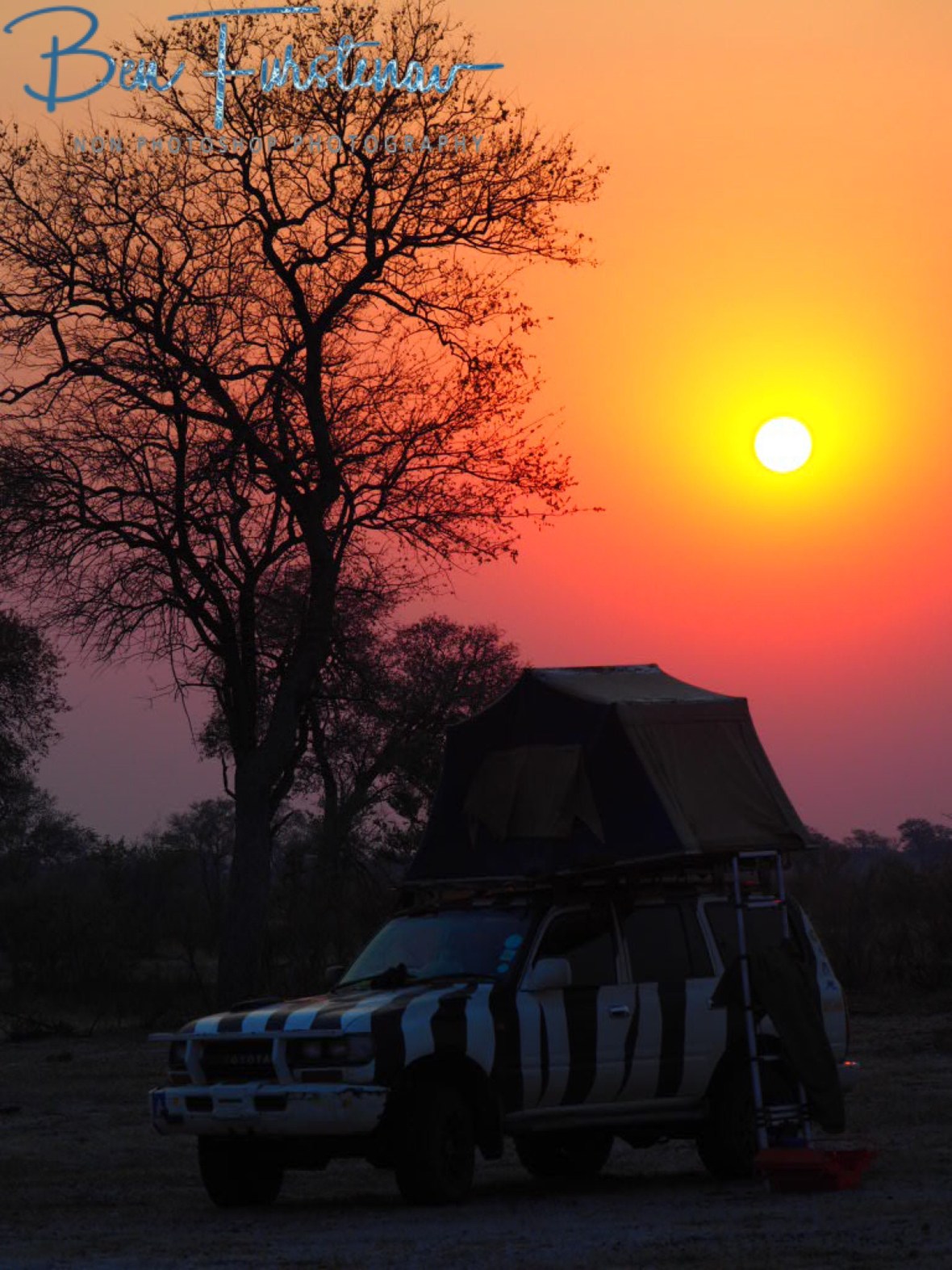 Orange skies over Zimba, Khaudum National Park, Namibia