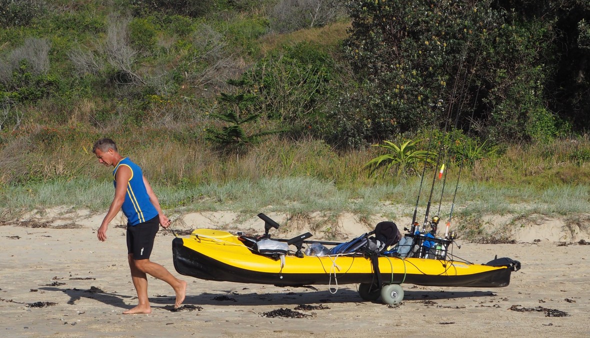 Kayak transport at Diggers Beach, New South Wales, Australia
