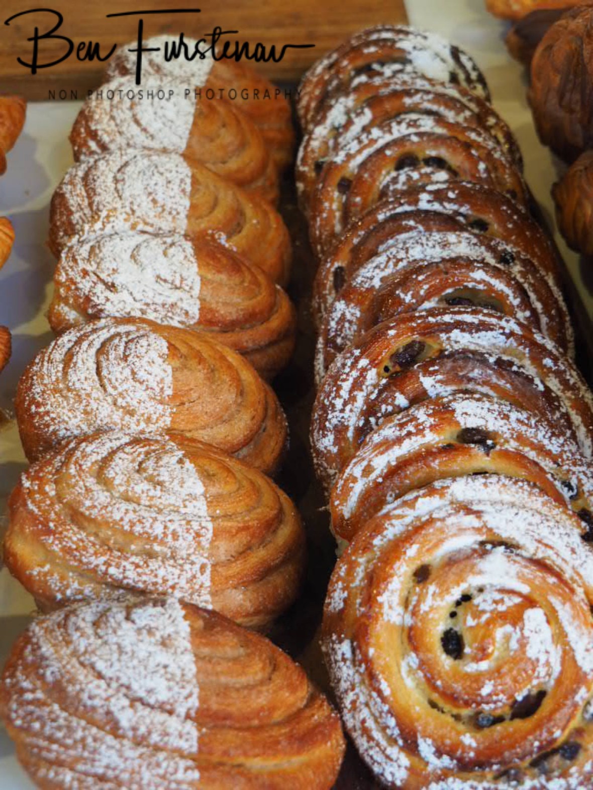 Cinnamon danish and pain aux raisins at display, Newrybar, New South Wales, Australia