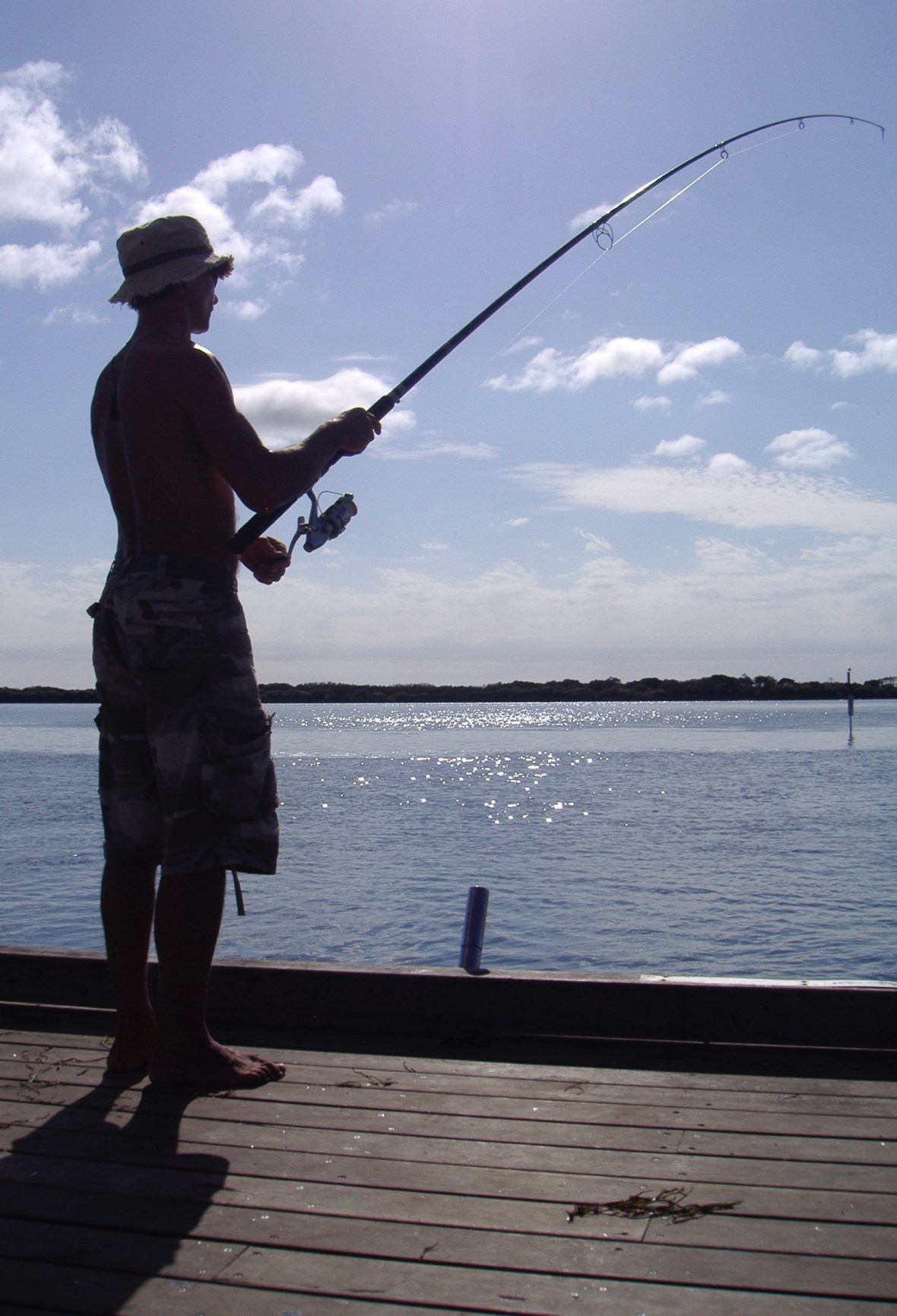 Fishing off the jetty in Caloundra, Queensland, Australia 