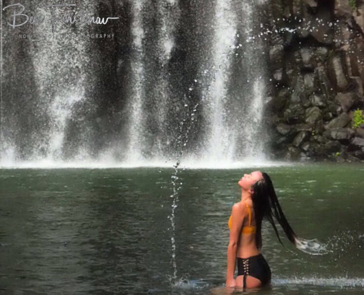 Finishing touch at Millaa Millaa Falls, Atherton Tablelands, Far North Queensland, Australia